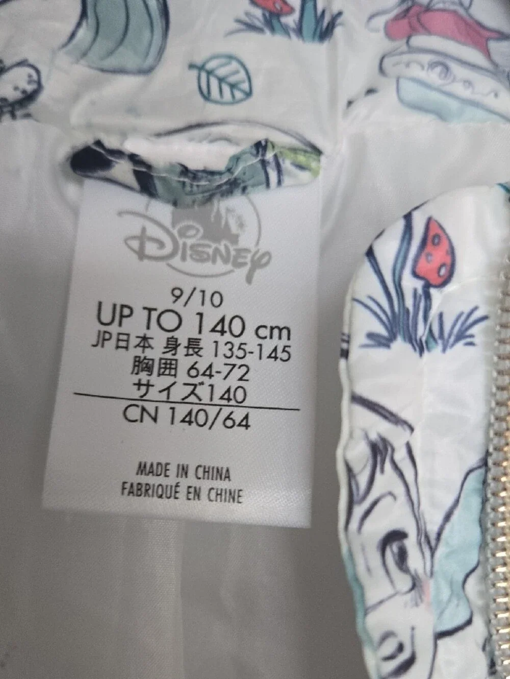 Disney Quilted Puffer Jacket with Cream Background and Pastel Accents